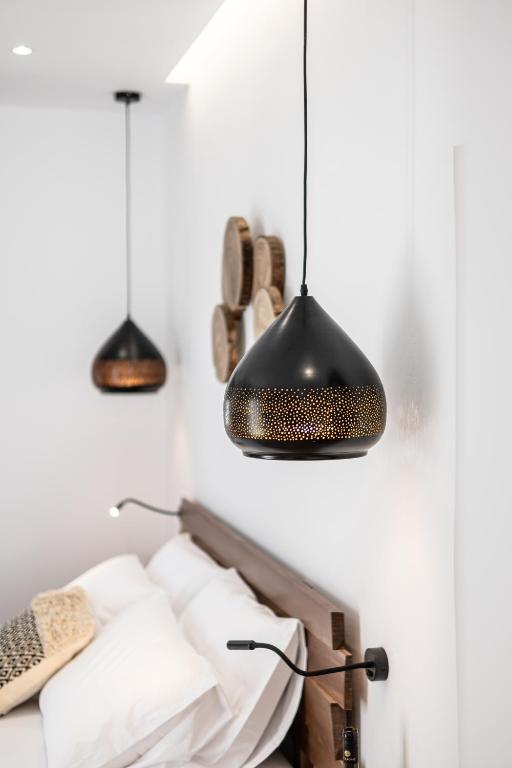 Postel nebo postele na pokoji v ubytování Galazia Boutique Apartments