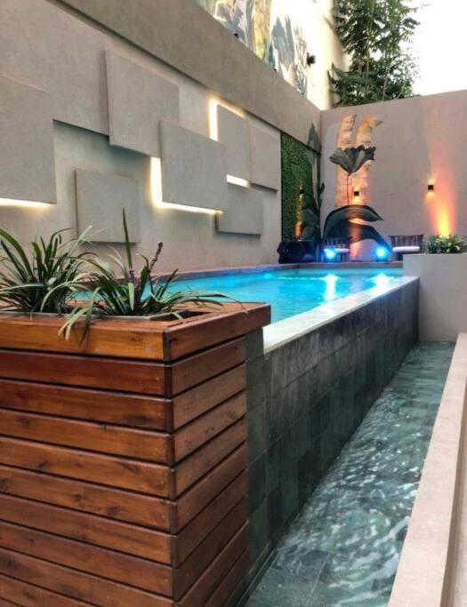 a swimming pool in the middle of a house at Usina AS Salta in Salta