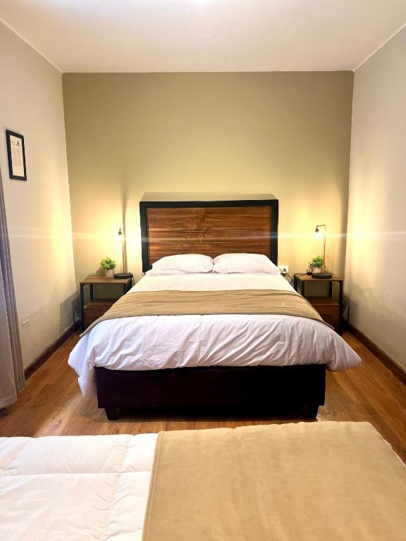 Postel nebo postele na pokoji v ubytování Hostal María Angola