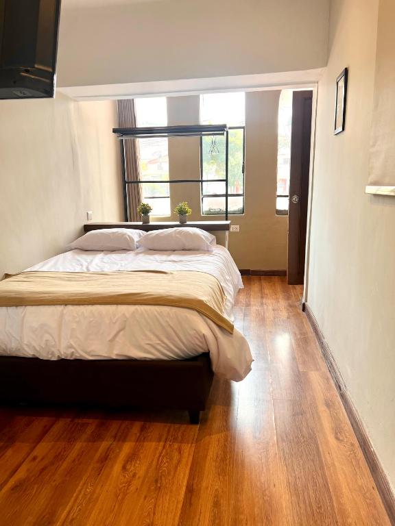 Postel nebo postele na pokoji v ubytování Hostal María Angola