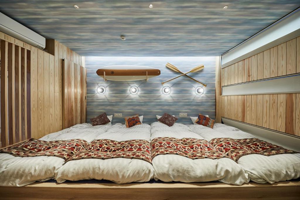 Postel nebo postele na pokoji v ubytování Hotel TORACO konohana