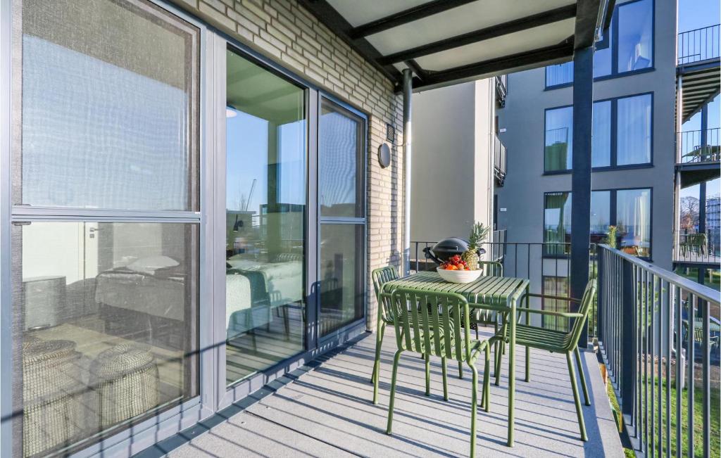 a balcony with a table and a chair on it at Pet Friendly Apartment in Lembruch
