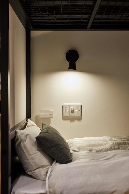 Postel nebo postele na pokoji v ubytování Hotel TORACO konohana