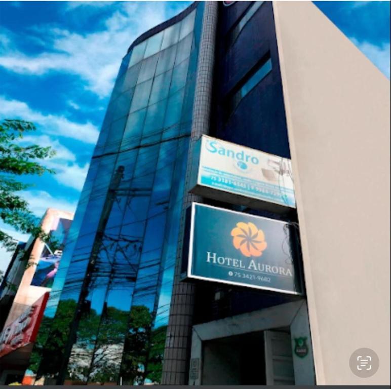 a building with two signs on the side of it at Hotel Aurora in Alagoinhas