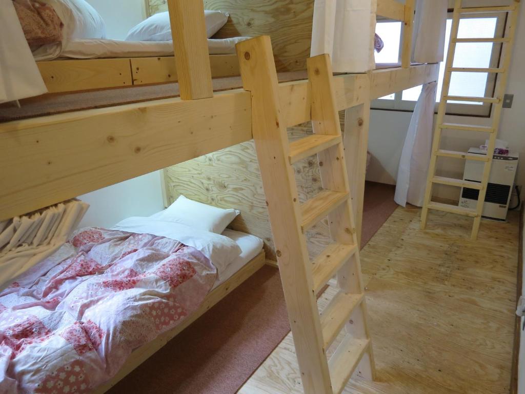 Postel nebo postele na pokoji v ubytování SappoLodge