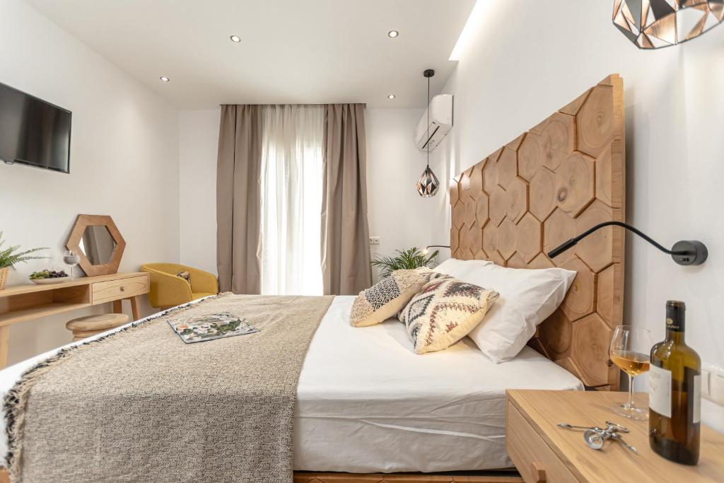 Postel nebo postele na pokoji v ubytování Galazia Boutique Apartments