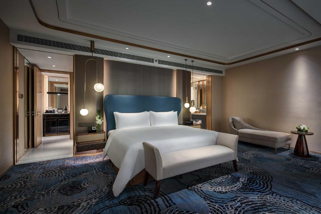 Postel nebo postele na pokoji v ubytování Primus Hotel Shanghai Hongqiao