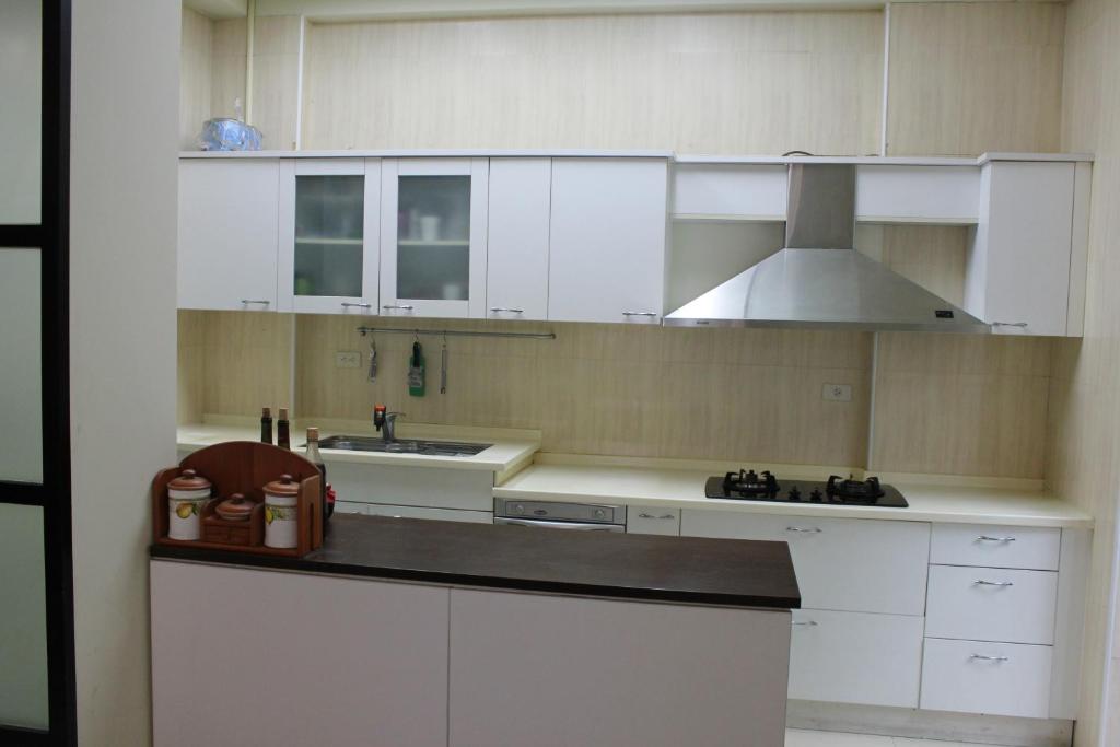 Kuchyň nebo kuchyňský kout v ubytování Sunny Breeze Garden Homestay