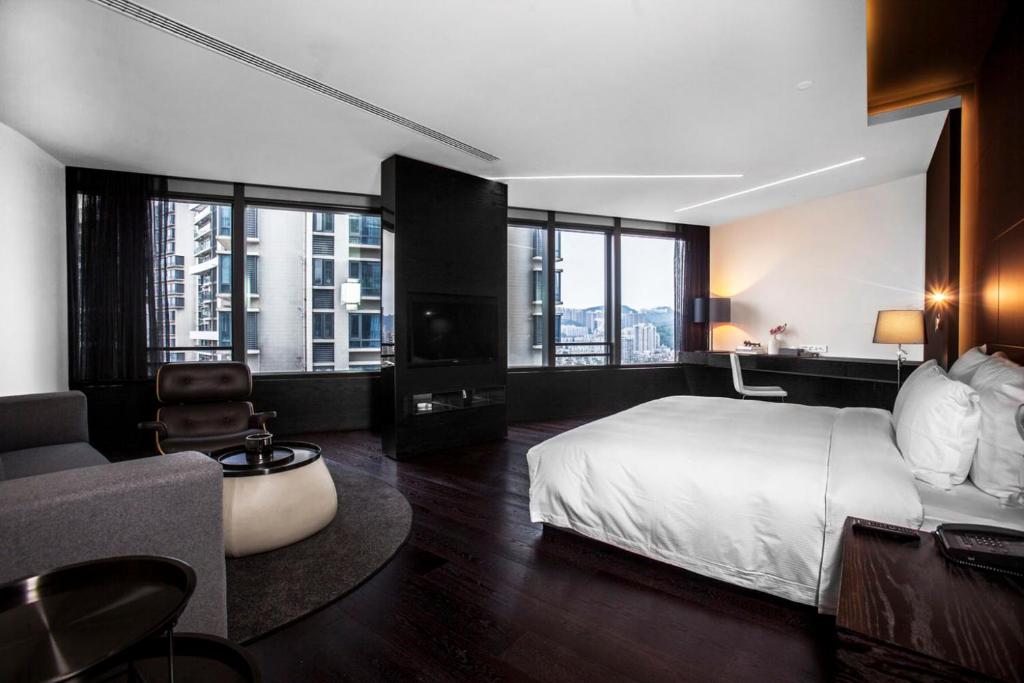 Postel nebo postele na pokoji v ubytování Shenzhen O Hotel