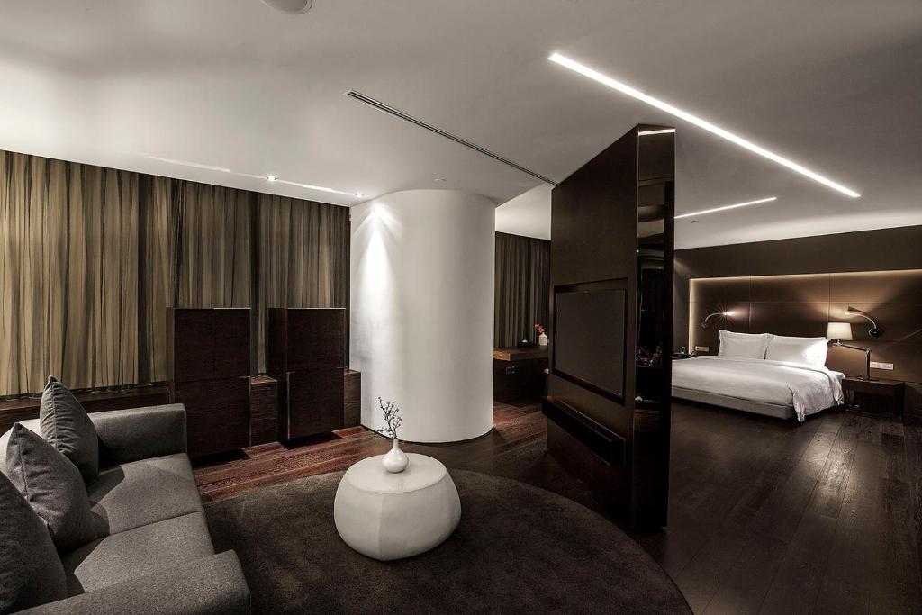 Postel nebo postele na pokoji v ubytování Shenzhen O Hotel