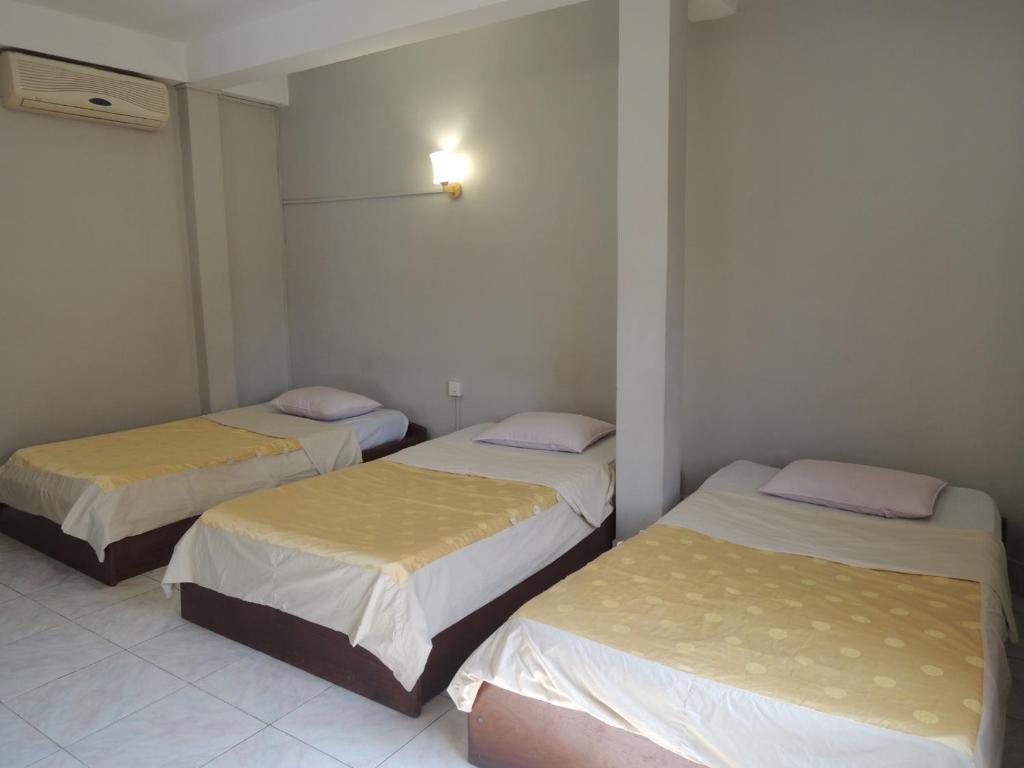 Postel nebo postele na pokoji v ubytování The Grey Guesthouse