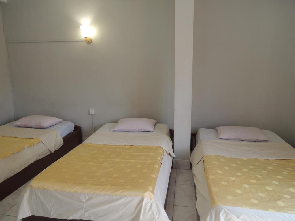 Postel nebo postele na pokoji v ubytování The Grey Guesthouse