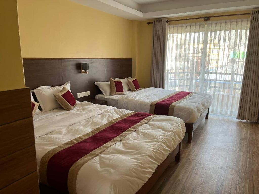 A bed or beds in a room at Hotel Hidden Kingdom