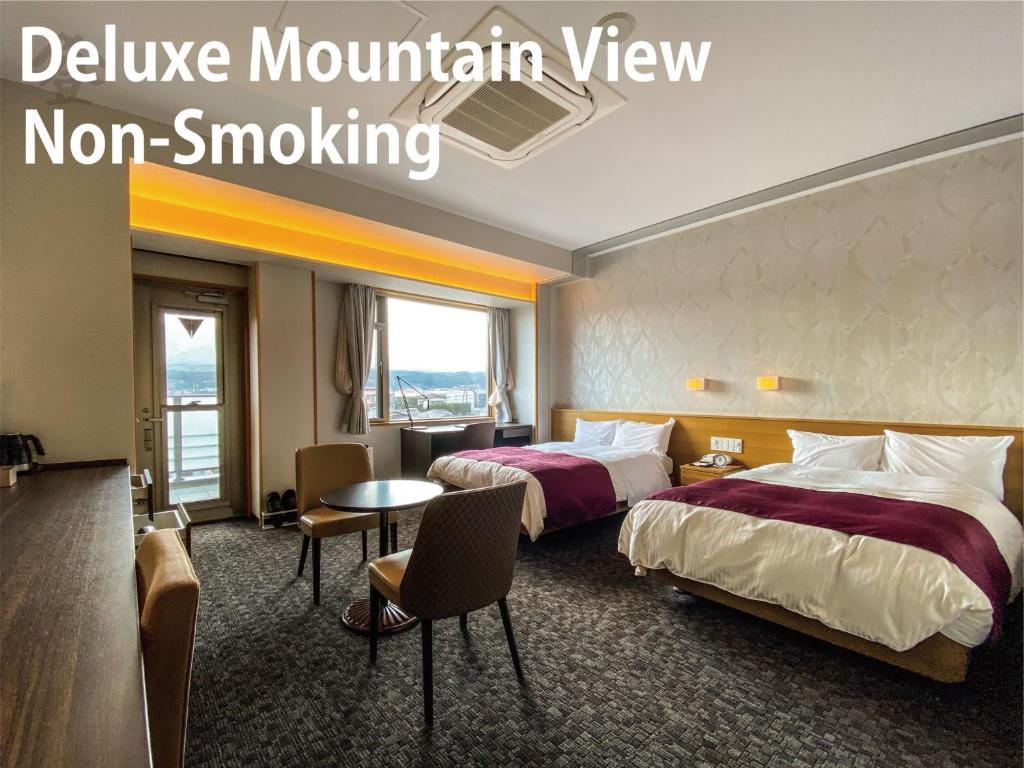 Postel nebo postele na pokoji v ubytování Hotel Noborisaka