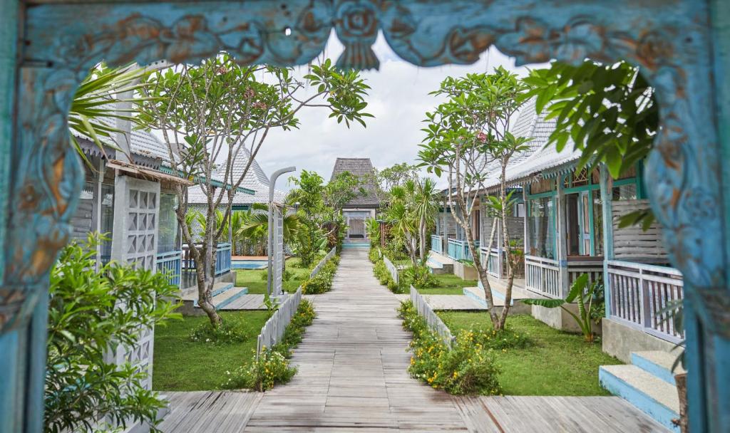 a walkway between houses in a resort at Casa Batu Belig in Seminyak