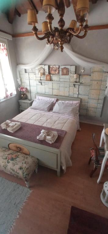 Postel nebo postele na pokoji v ubytování Piccola Casa Shabby 500m castello di Este