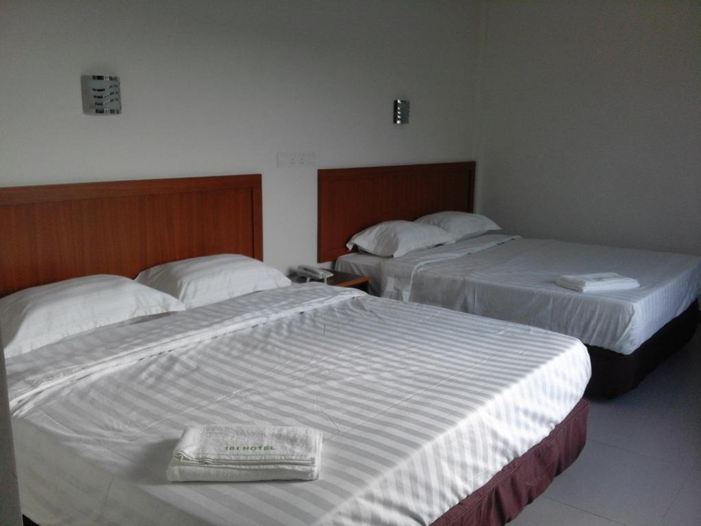 Postel nebo postele na pokoji v ubytování 101 Hotel