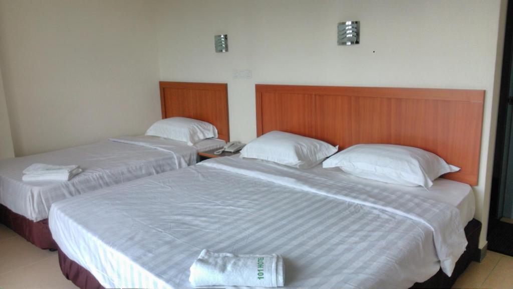 Postel nebo postele na pokoji v ubytování 101 Hotel