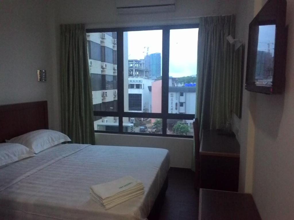 Postel nebo postele na pokoji v ubytování 101 Hotel
