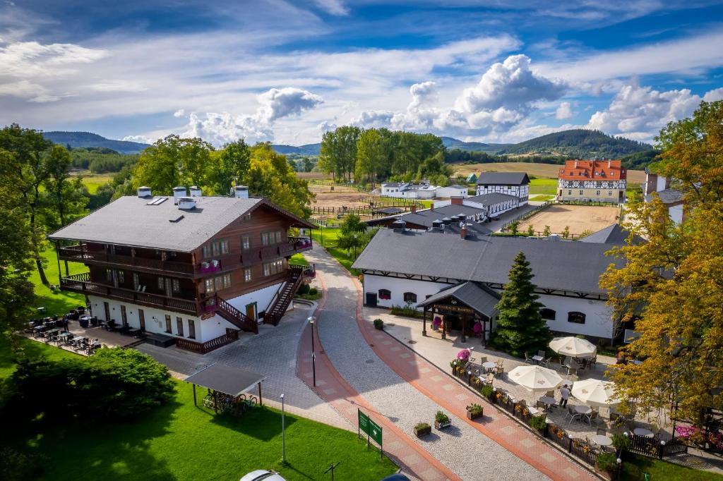 an aerial view of a town with a large building at Resort Dworzysko in Szczawno-Zdrój