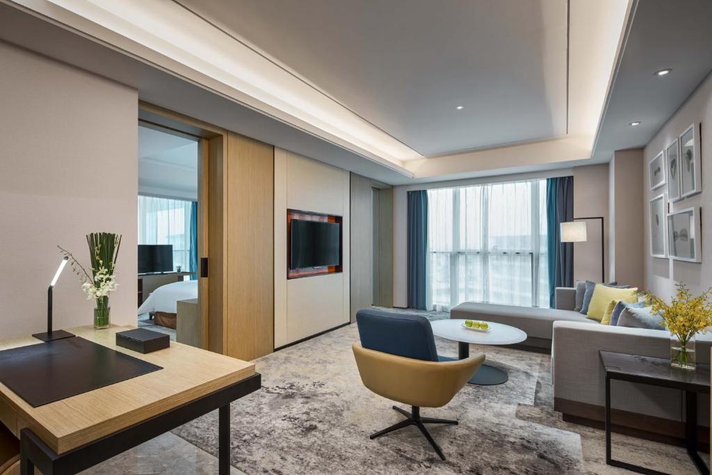 TV a/nebo společenská místnost v ubytování The QUBE Hotel Shanghai Hongqiao