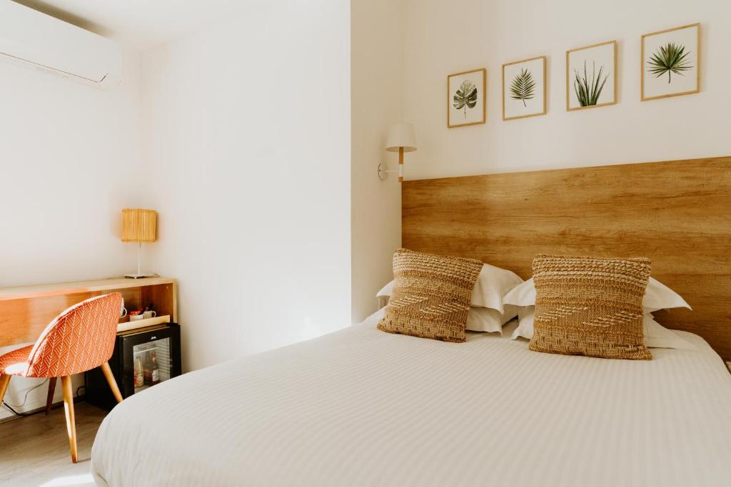 Postel nebo postele na pokoji v ubytování Palm Boutique Hôtel Nice