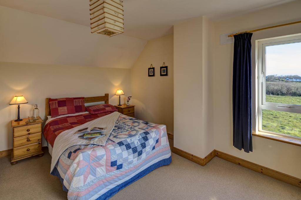 Postel nebo postele na pokoji v ubytování Glencarrig B&B
