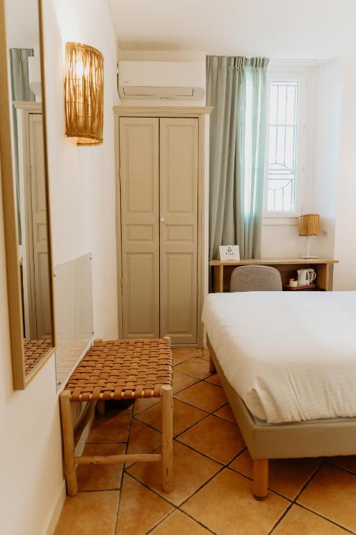 Postel nebo postele na pokoji v ubytování Palm Boutique Hôtel Nice