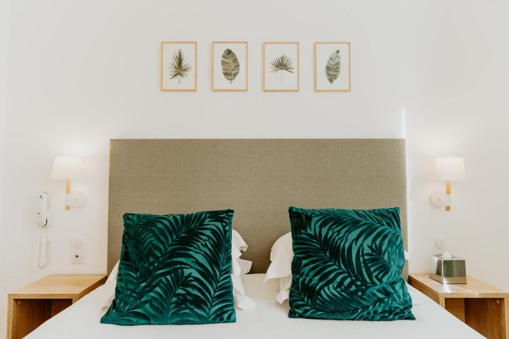 Postel nebo postele na pokoji v ubytování Palm Boutique Hôtel Nice
