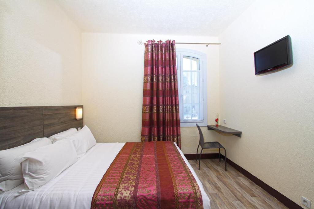 Postel nebo postele na pokoji v ubytování Hotel Le 21