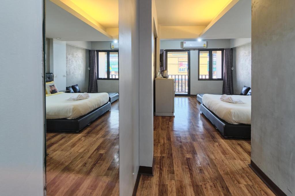 Postel nebo postele na pokoji v ubytování Bkk39 Airport hotel