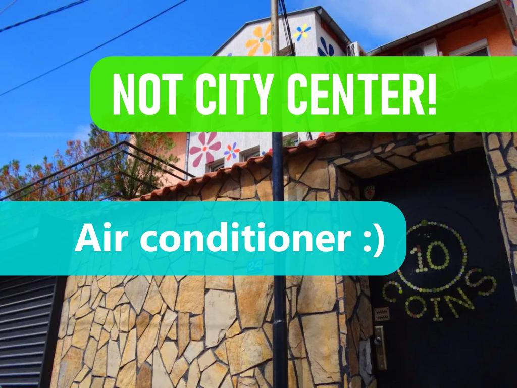 a sign that reads not city center air conditioner at 10 Coins Hostel & tours in Sofia