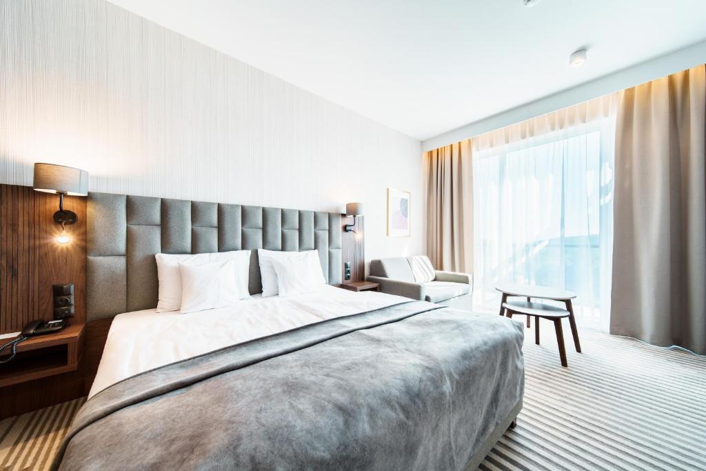 Łóżko lub łóżka w pokoju w obiekcie Elements Hotel&Spa