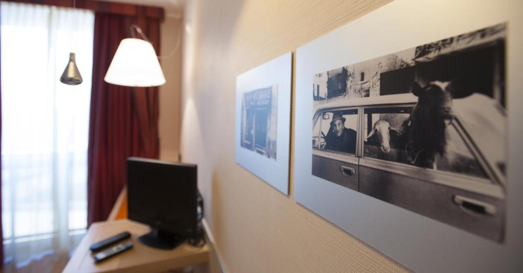 Televízia a/alebo spoločenská miestnosť v ubytovaní AlbaResidence Masera26