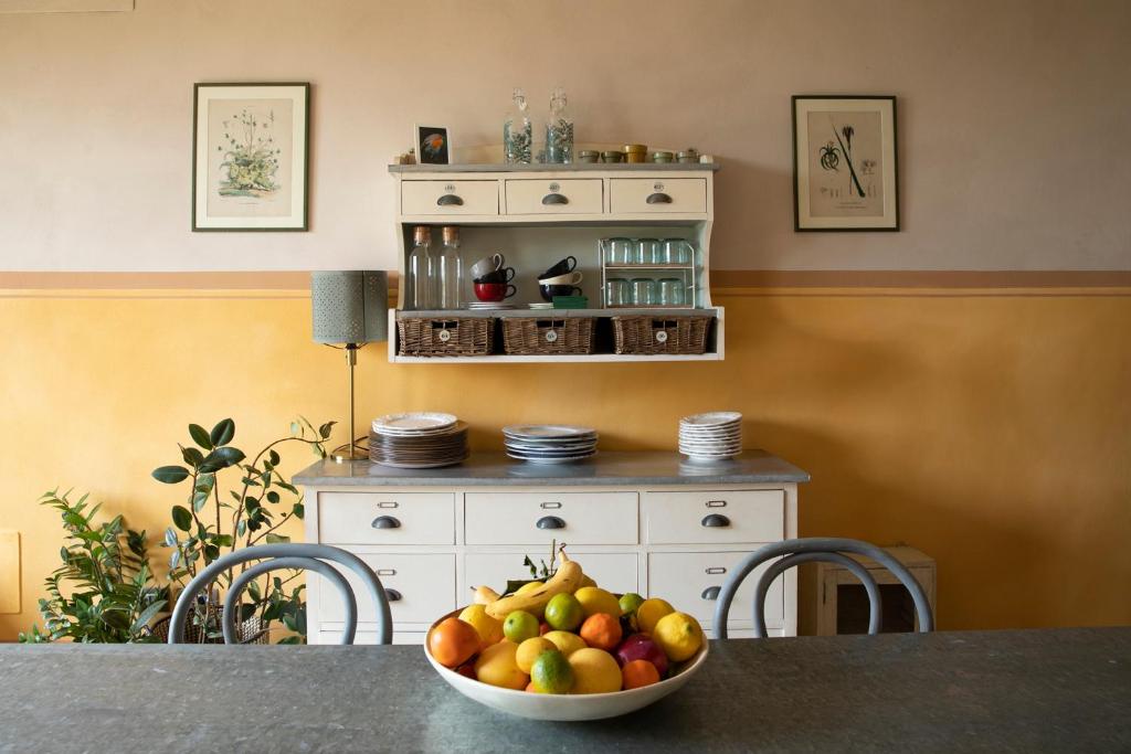 a bowl of fruit on a table in a room at * * * * * Splendida casa di campagna in Castenaso