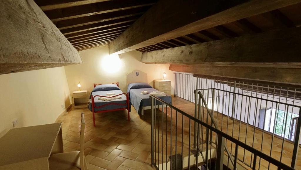 Postel nebo postele na pokoji v ubytování Borgo de' Varano by Hotel I Duchi