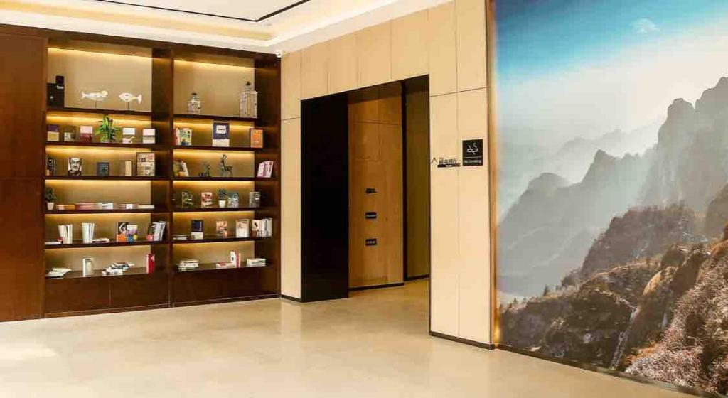 a hotel lobby with a large painting on the wall at Atour Hotel Xi'an Bell Tower North Street Station in Xi'an