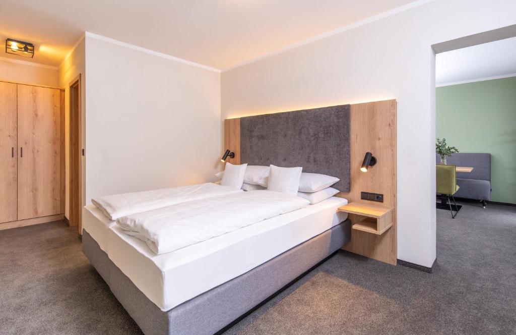 Postel nebo postele na pokoji v ubytování Hotel Schwan