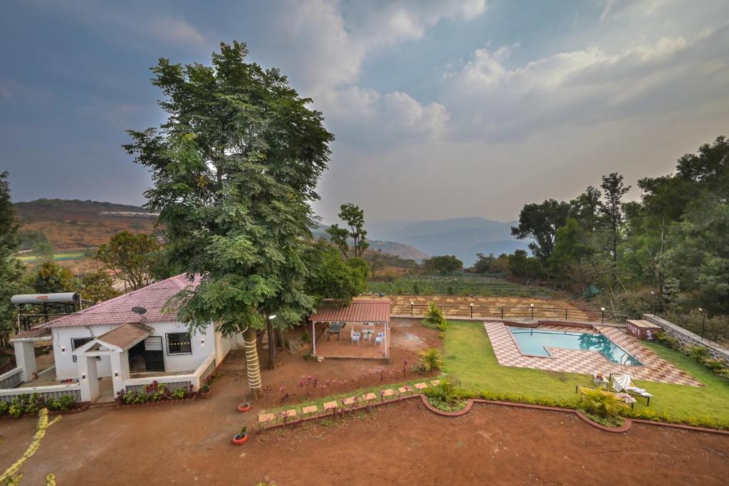 an aerial view of a house with a swimming pool at Infinity Pool 2bhk Villa with valley view in Panchgani