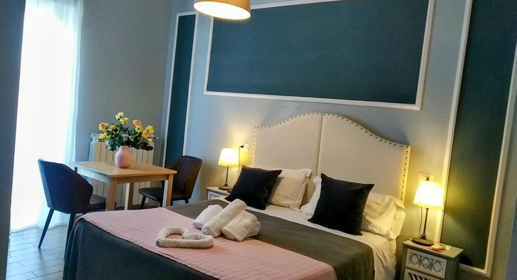 Postel nebo postele na pokoji v ubytování Hotel magnolia 1000 mt dal casello