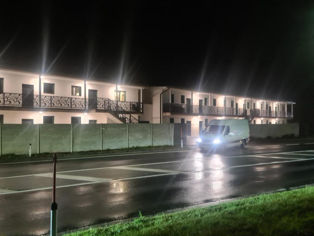 a truck driving down a street at night at TEREC HAUS in Bruckneudorf