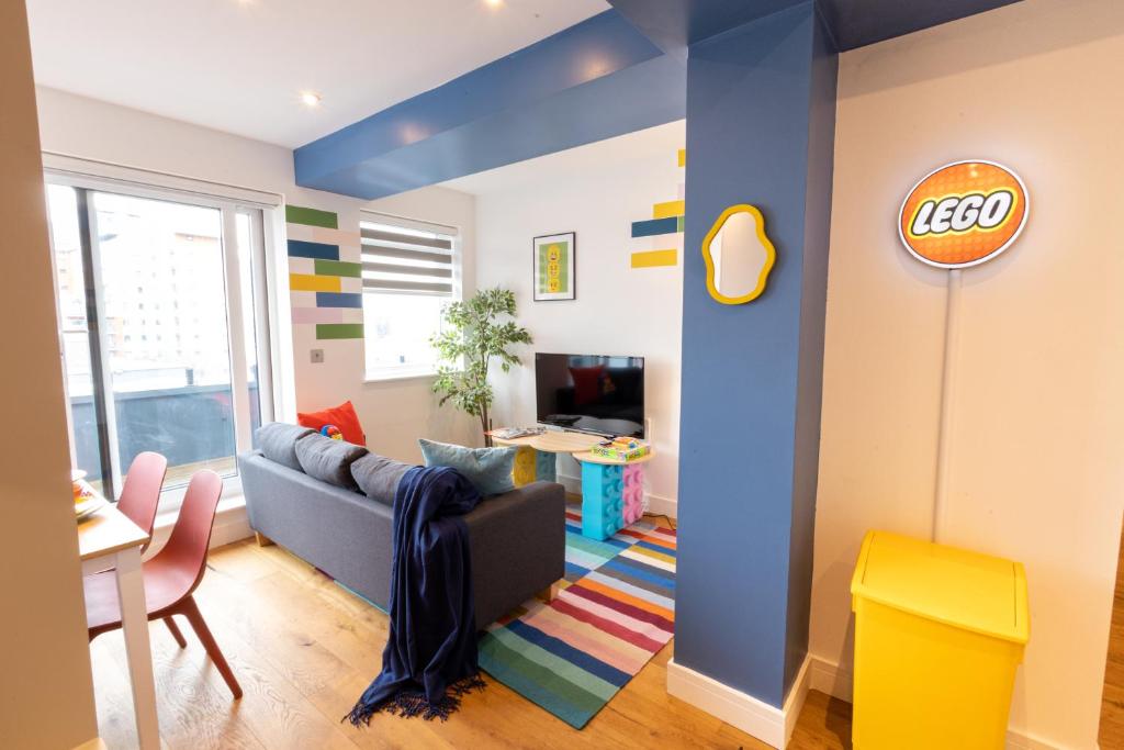 a living room with a couch and a table at Two-Bedroom Legoland Windsor Resort by Belvilla in Slough