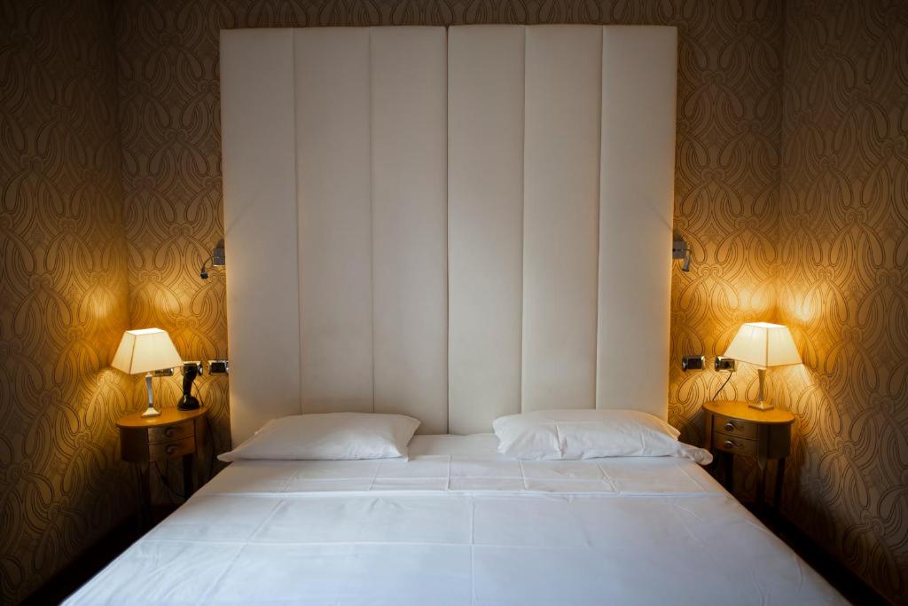 Postel nebo postele na pokoji v ubytování LH Hotel Andreotti