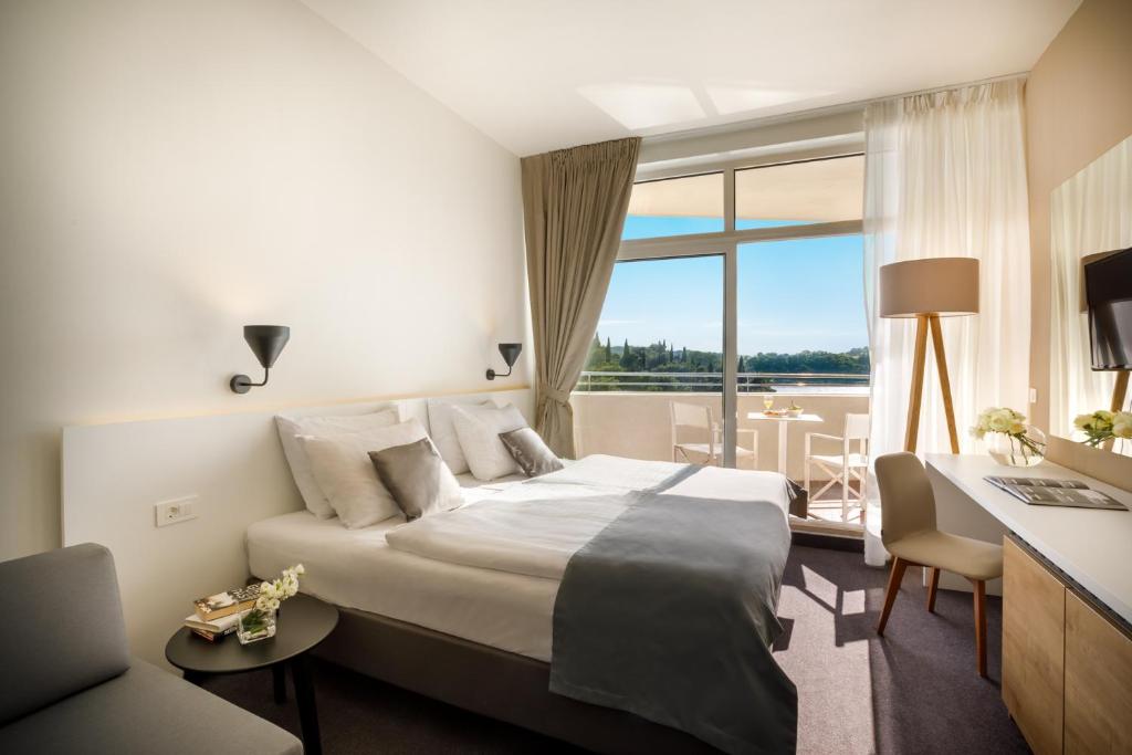 Postel nebo postele na pokoji v ubytování Remisens Hotel Albatros-All inclusive