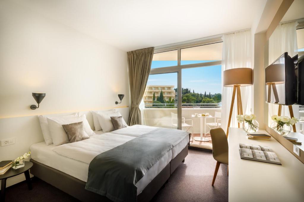 Postel nebo postele na pokoji v ubytování Remisens Hotel Albatros-All inclusive