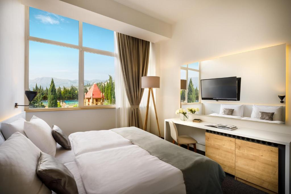 TV a/nebo společenská místnost v ubytování Remisens Hotel Albatros-All inclusive