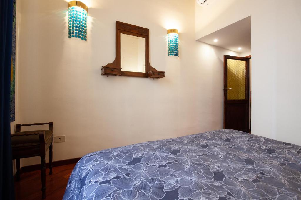 A bed or beds in a room at Il giardino di Bobo