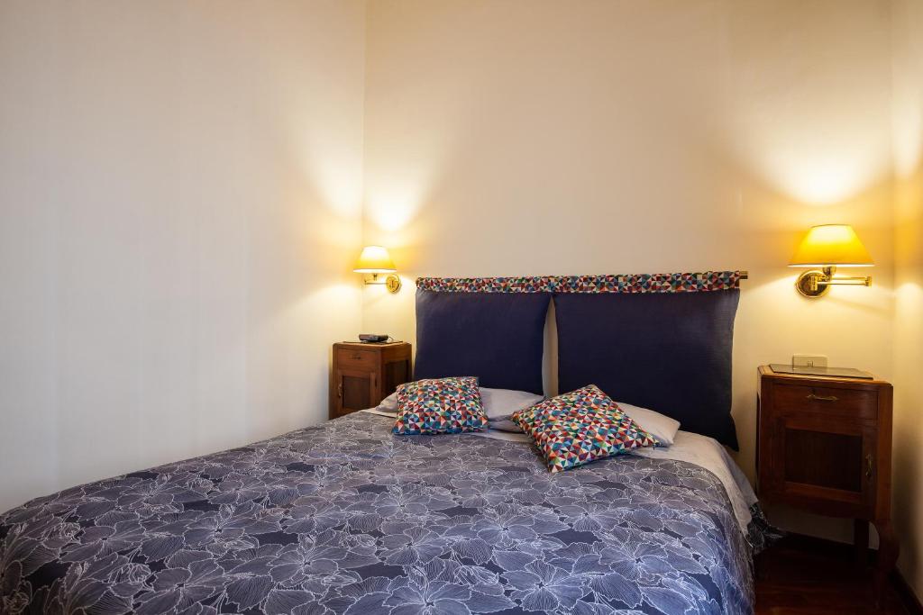 A bed or beds in a room at Il giardino di Bobo