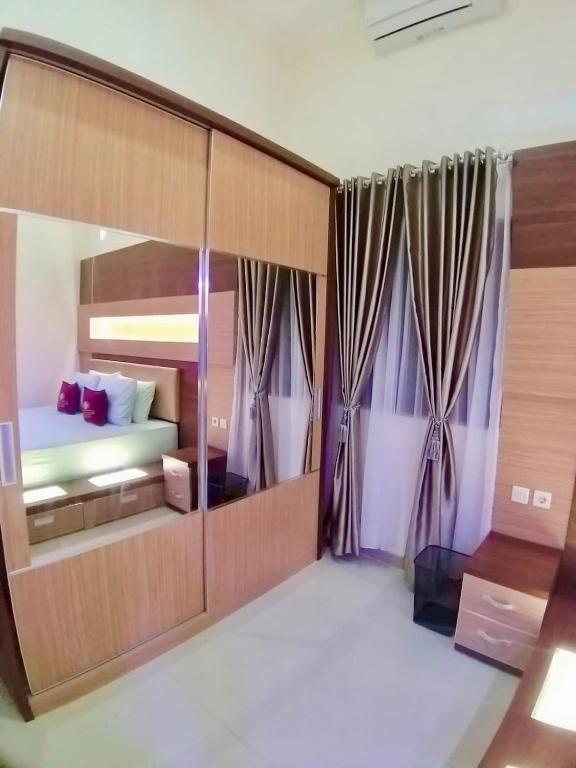 Postel nebo postele na pokoji v ubytování Prime House Muntilan