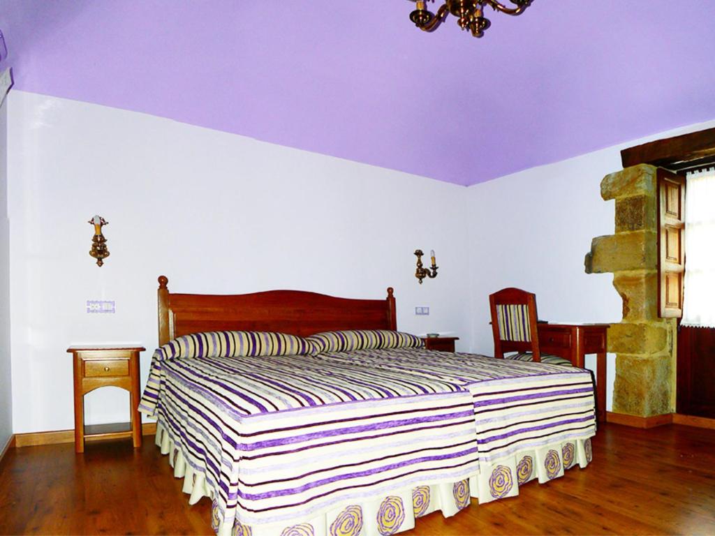 Postel nebo postele na pokoji v ubytování Posada Ribera del Pas